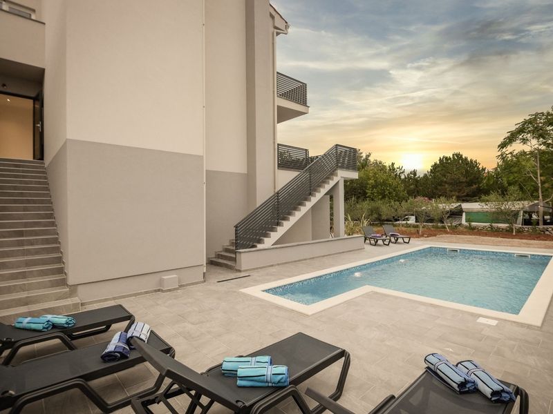 Modern apartment Lacrima 1 with breakfast in villa with a pool on Krk.
