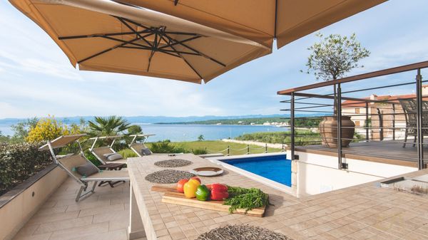 Beachfront Villa Marconica with a sea view and a pool on Krk