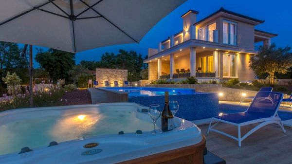 Stone house Villa Roko with a sea view and an outdoor pool on Krk
