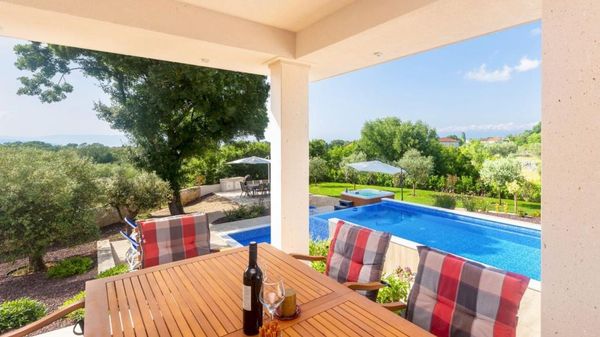 Stone house Villa Roko with a sea view and an outdoor pool on Krk