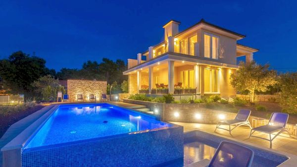 Stone house Villa Roko with a sea view and an outdoor pool on Krk