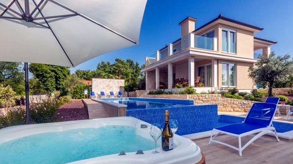 Stone house Villa Roko with a sea view and an outdoor pool on Krk