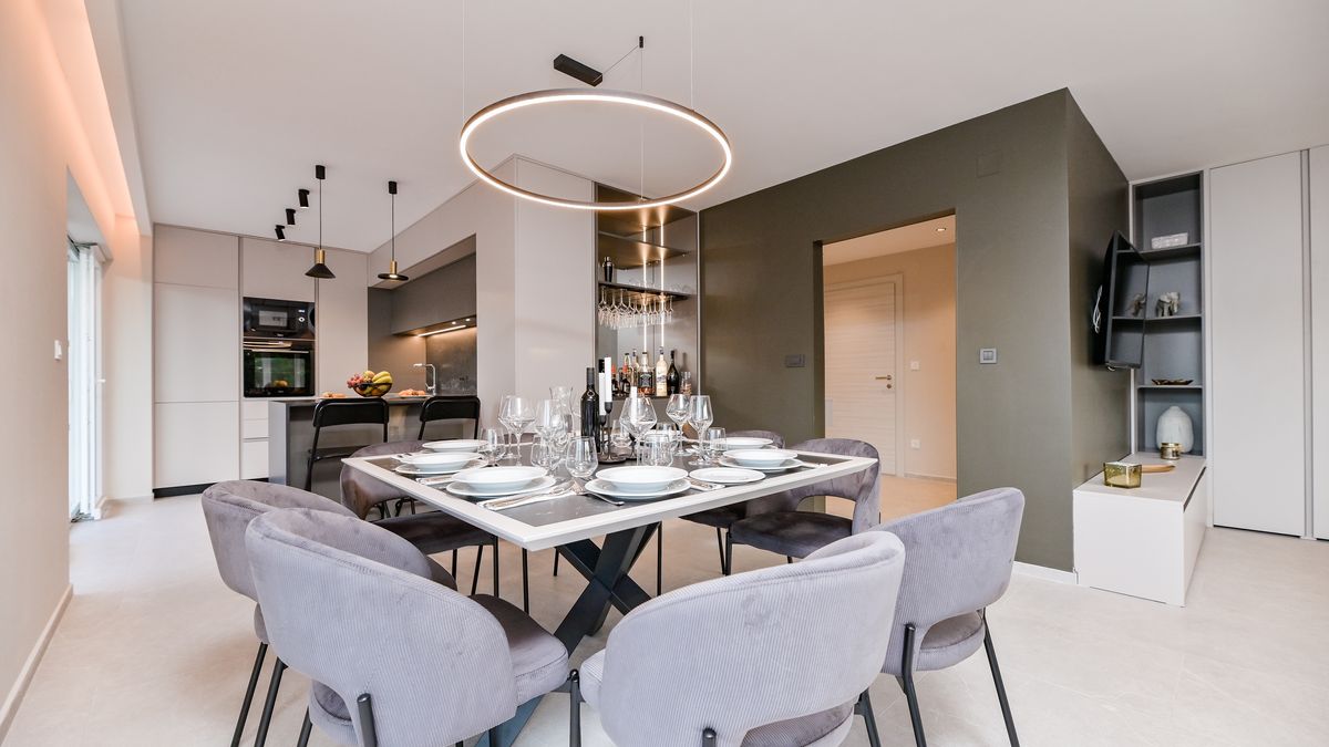 Elegant Lacrima 4 apartment dining room with modern kitchen and large dining table on Krk Island
