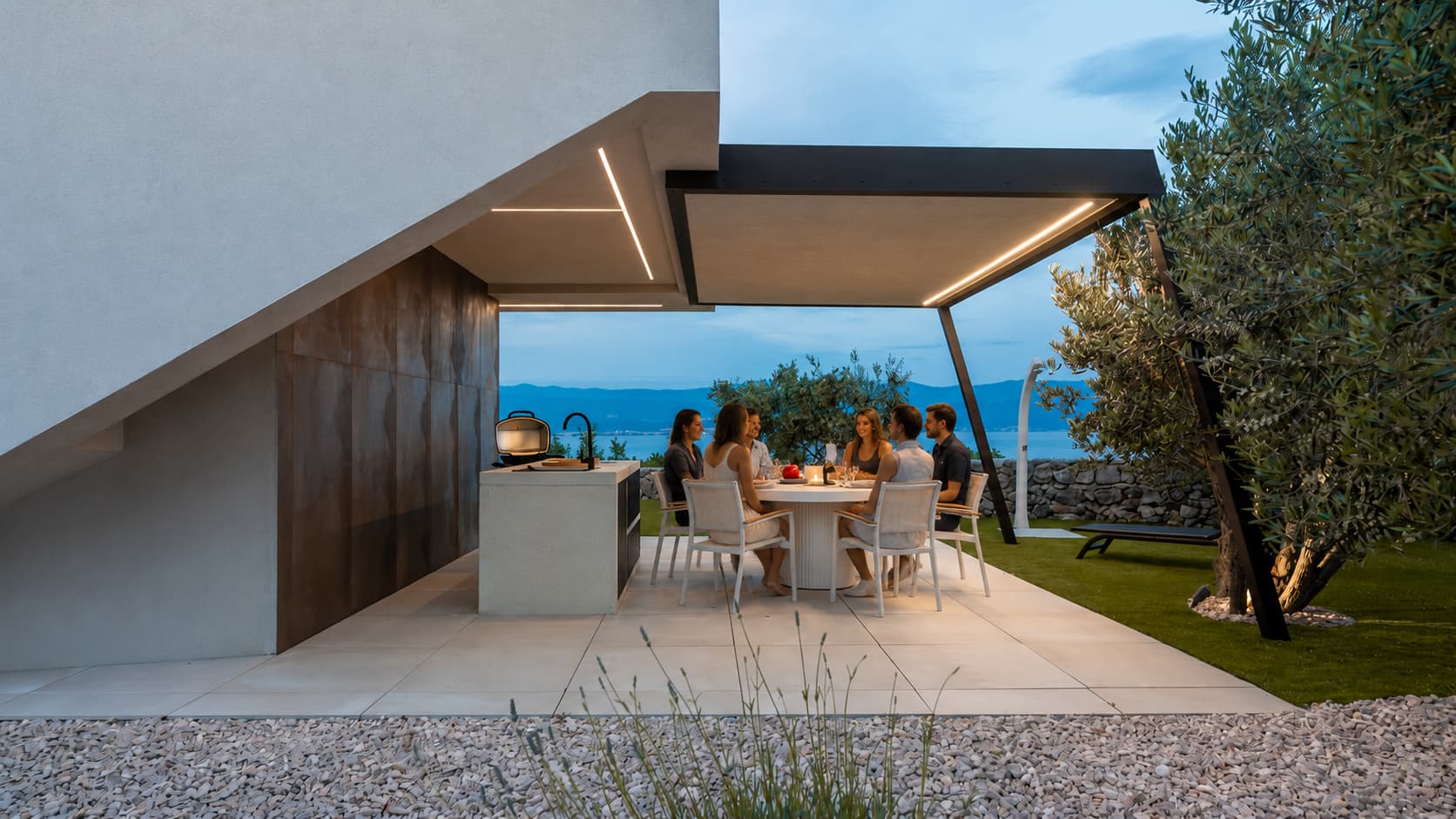 Group of friends dining on the outdoor terrace of Villa Maslina with sea view in Vrbnik on Krk Island
