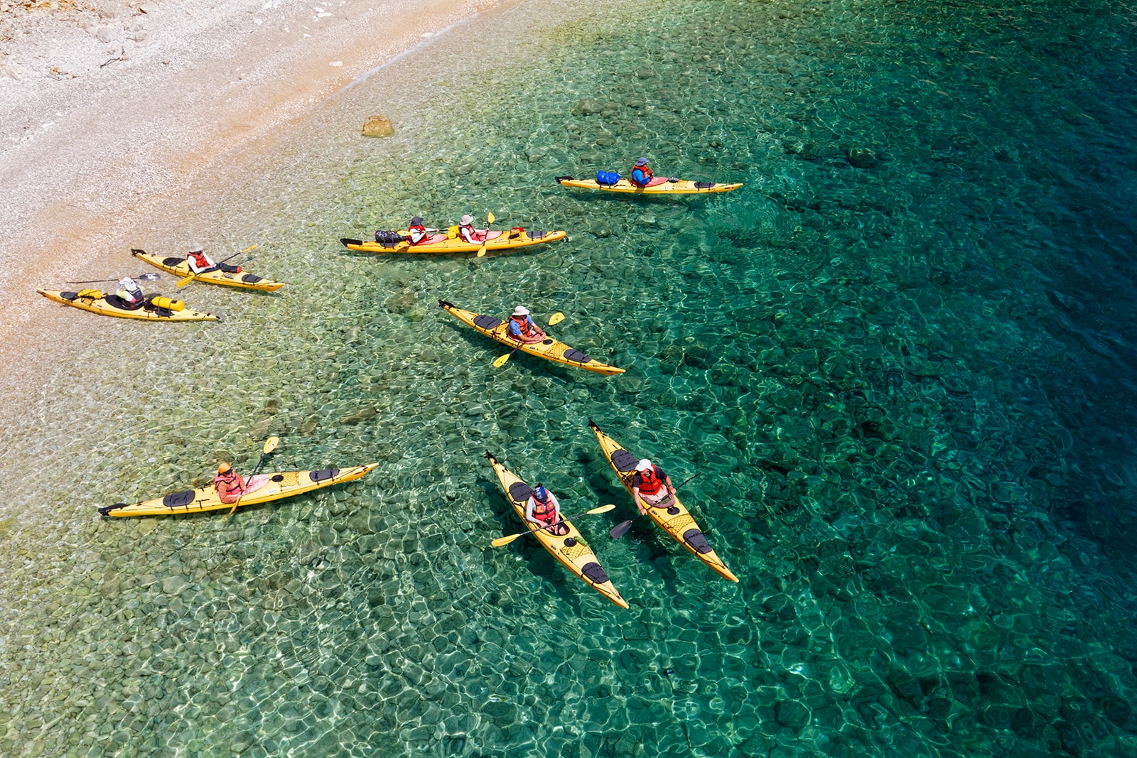 Kayaking on the Adriatic Sea near Krk Island in summer, showing outdoor activities