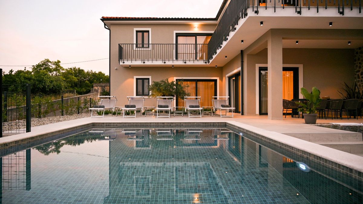 Villa Figa 2 with private pool on Krk Island at dusk, relevant for larger family accommodation
