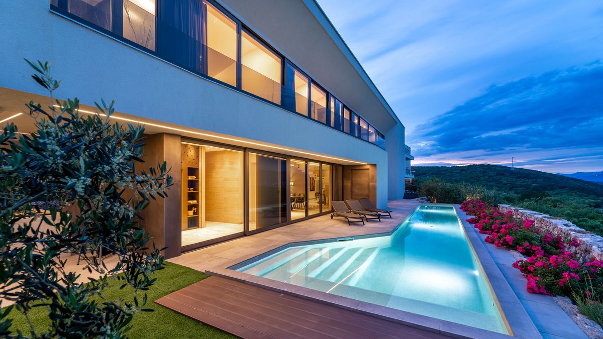 Luxury Villa Panoramica with illuminated pool and panoramic view of the Adriatic
